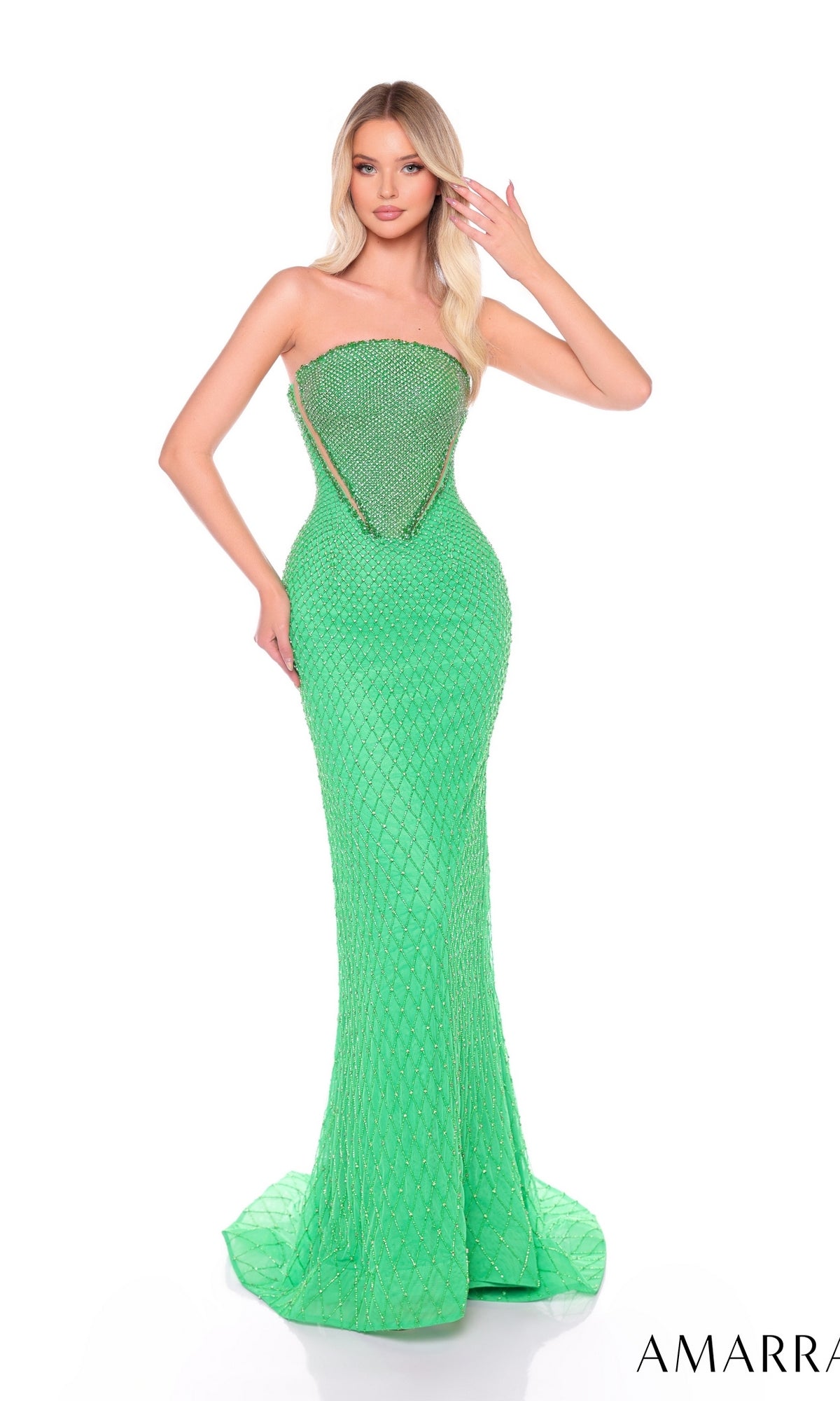 A woman models the Long Formal Dress 88112 by Amarra, a beaded, strapless, fitted formal gown in bright green, highlighting its elegant embellishments against a plain white backdrop.
